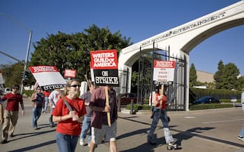 Writers Guild overwhelmingly approves plan to strike